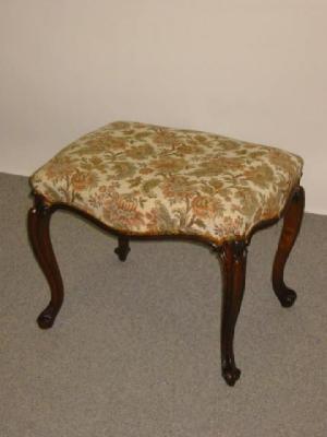 Appraisal: A VICTORIAN MAHOGANY STOOL of oblong serpentine form upholstered in