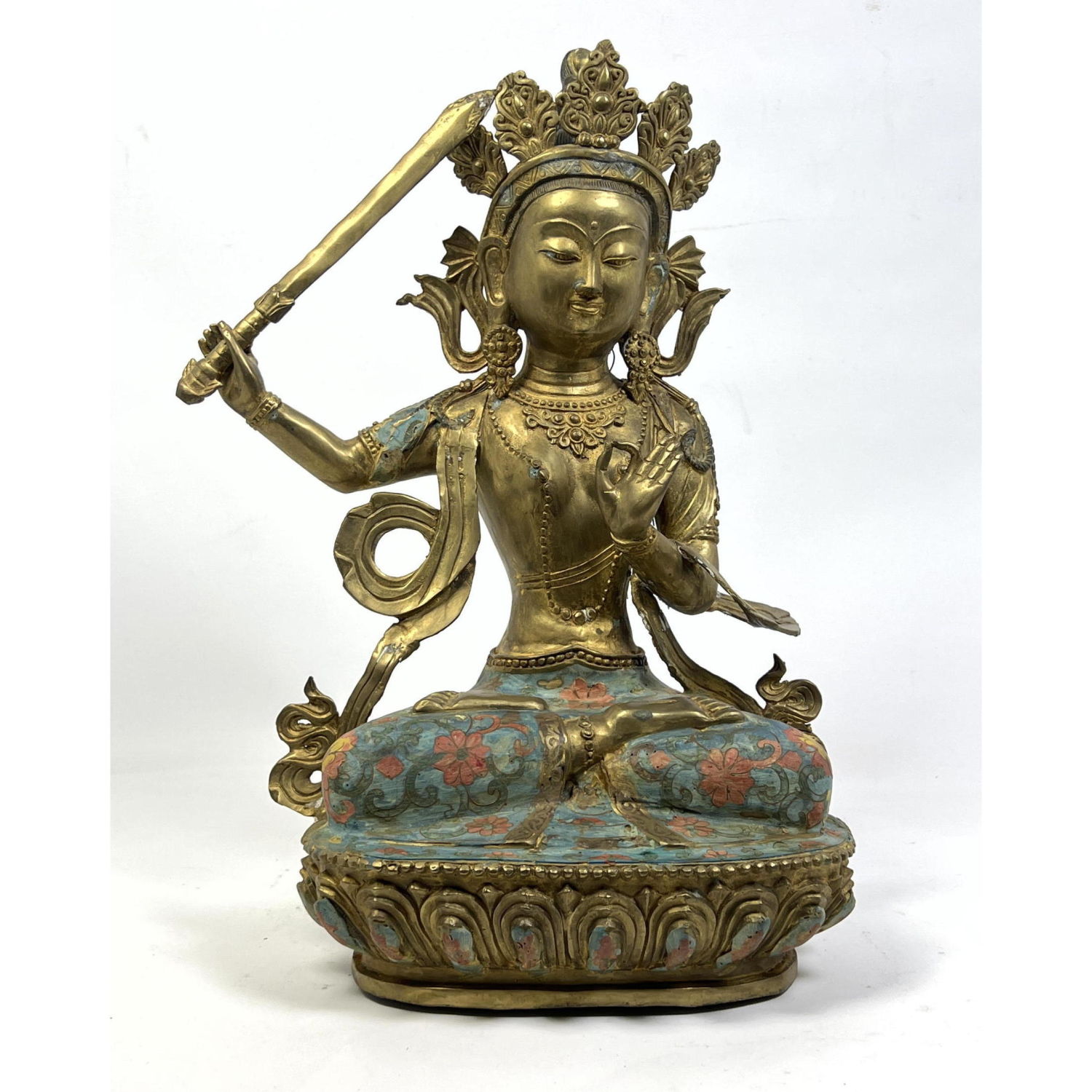 Appraisal: Gilt Bronze Asian Goddess seated on Enameled Lotus Base Sword