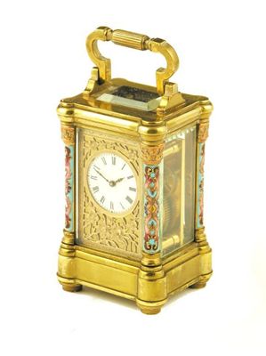 Appraisal: A French miniature brass carriage clock numbered with a platform