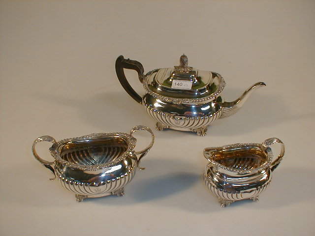 Appraisal: A late Victorian silver tea pot of semi-fluted oval design