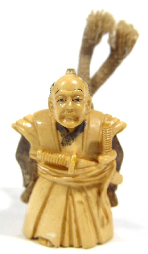 Appraisal: Oriental ivory Netsuke carved as a Samurai signature to base