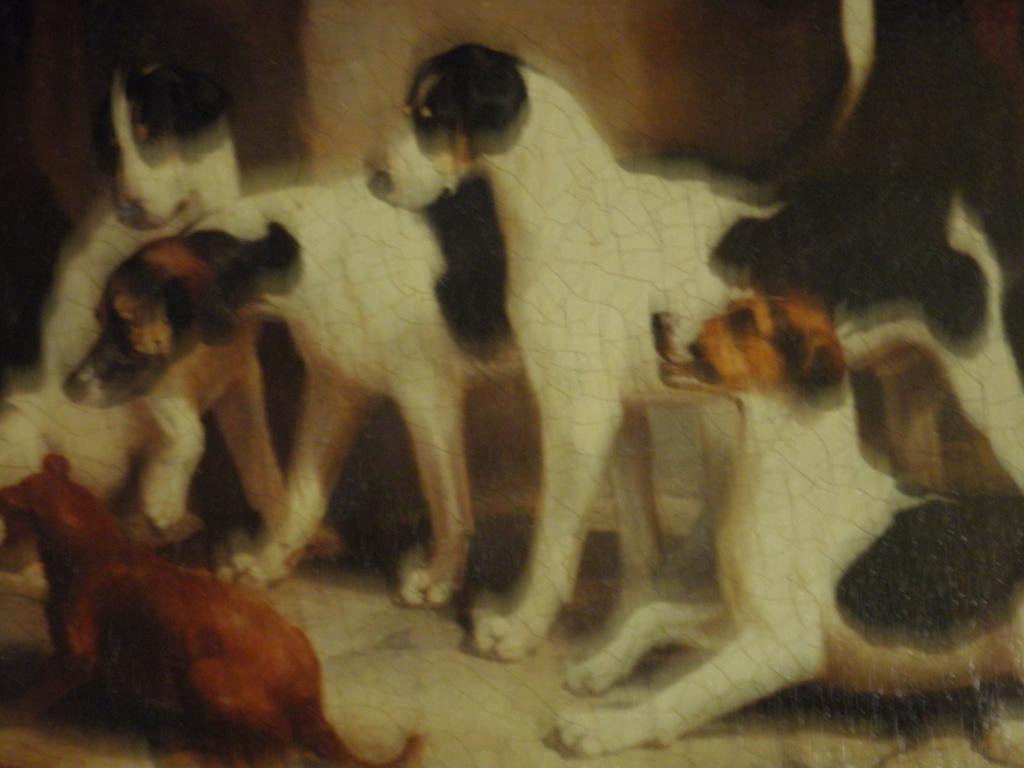 Appraisal: A pair of gilt framed reproduction prints on canvas Dogs