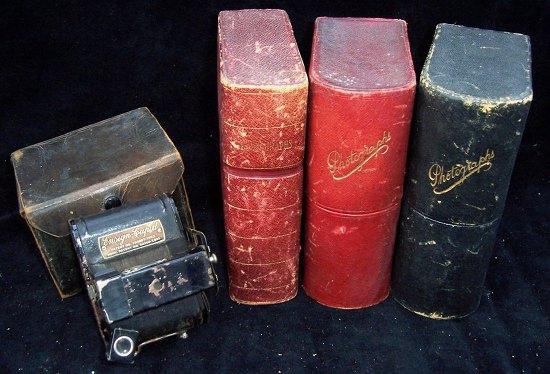 Appraisal: An Ensign Cupid camera with leather case and three photograph