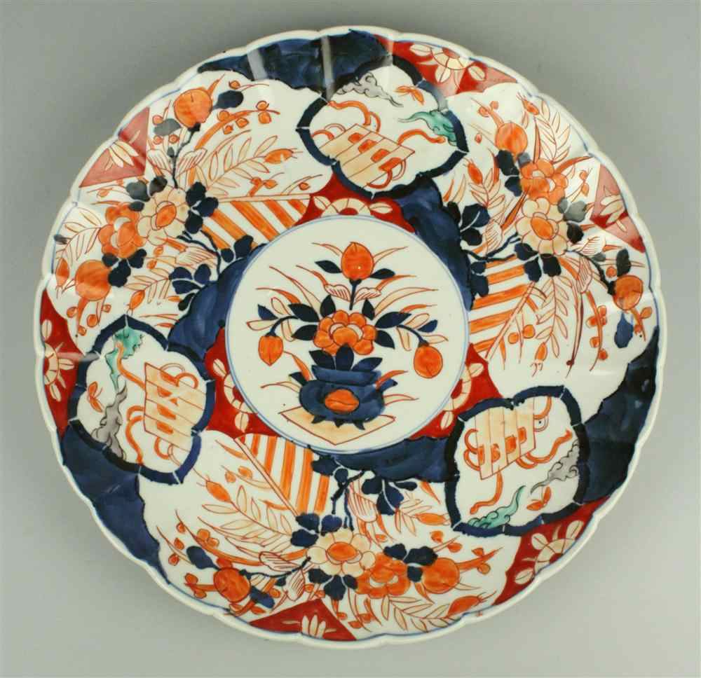 Appraisal: A SCALLOPED IMARI DISH decorated in typical colors with panels