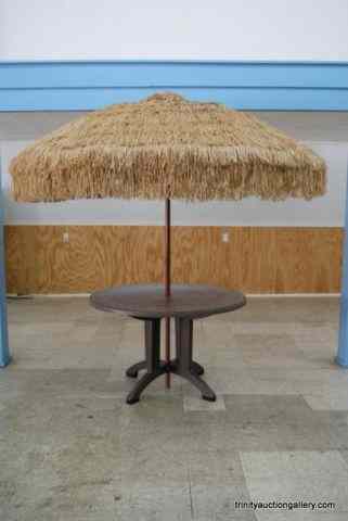 Appraisal: Faux Wicker Piazza Table Hula Umbrella Set From the estate