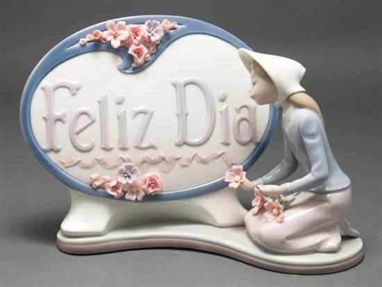 Appraisal: Lladro porcelain figural sign modeled as kneeling woman picking flowers