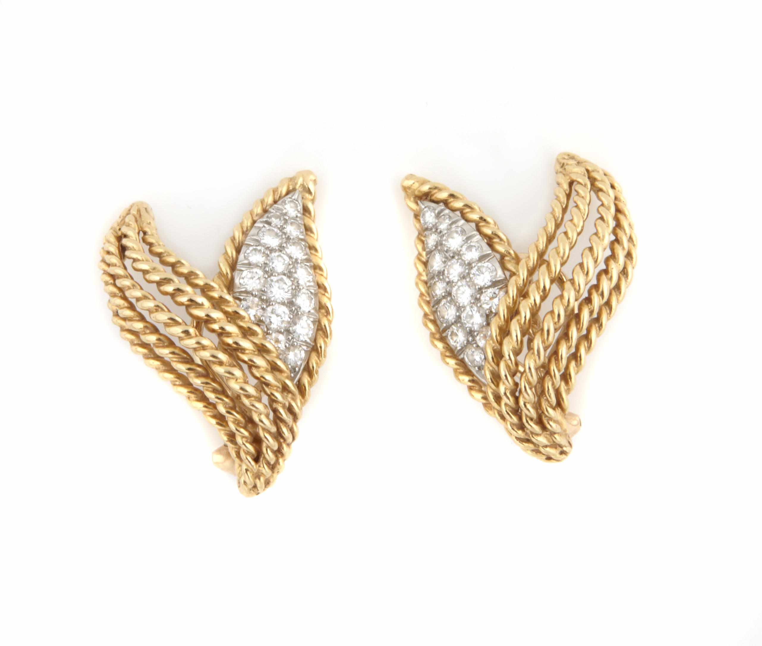 Appraisal: A pair of diamond and gold leaf motif earclips length