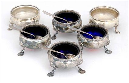 Appraisal: SET OF FOUR ENGLISH SILVER TRIPOD SALTS AND FOUR SPOONS