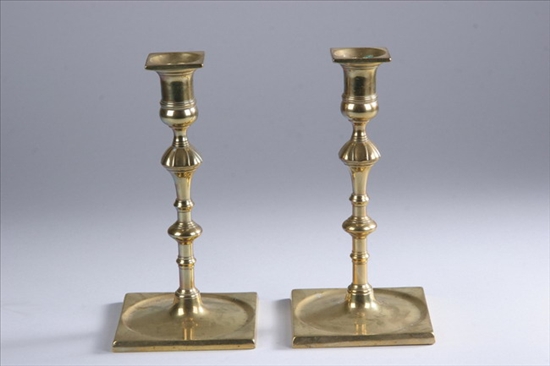 Appraisal: PAIR ENGLISH BRASS CANDLESTICKS Circa Square base with concave center