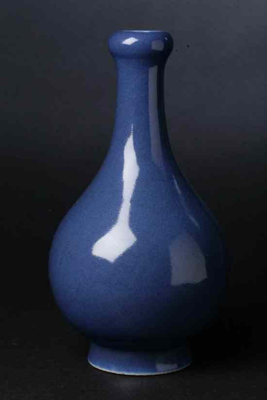 Appraisal: CHINESE MONOCHROME BLUE PORCELAIN VASE Qing Dynasty Garlic mouth pear-shaped