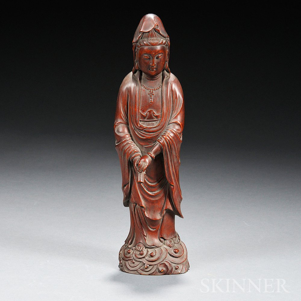 Appraisal: Huangyangmu Wood Guanyin China th century in standing pose holding