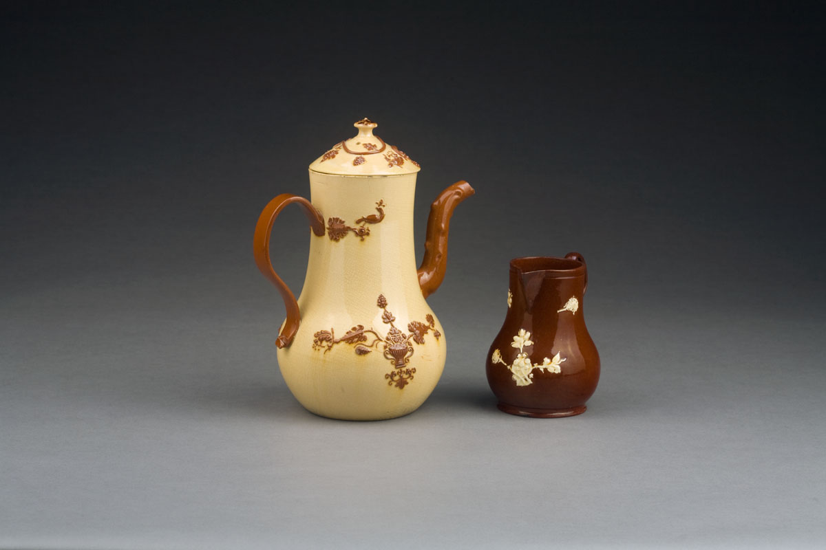 Appraisal: STAFFORDSHIRE EARTHENWARE 'ASTBURY'-TYPE COFFEEPOT AND COVER AND A JUG CIRCA