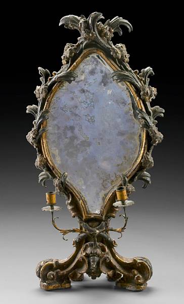 Appraisal: An Italian Baroque parcel gilt and paint decorated table mirror