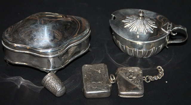 Appraisal: A SILVER TRINKET BOX of shaped form with rising lid