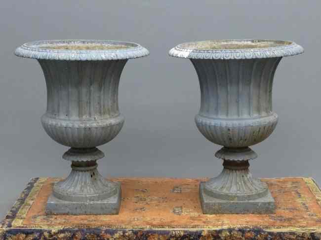 Appraisal: Pair th c cast iron urns '' Ht