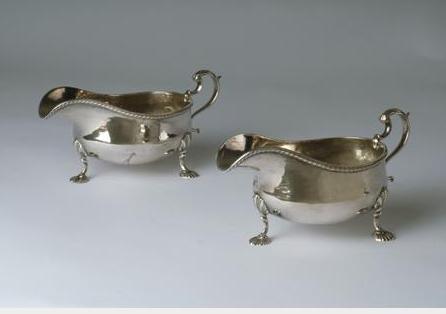 Appraisal: PAIR OF SHEFFIELD PLATE CRESTED SAUCEBOATS MATTHEW BOULTON - Each