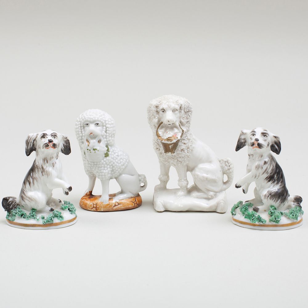 Appraisal: Four Continental Porcelain Models of Dogs One with a spurious