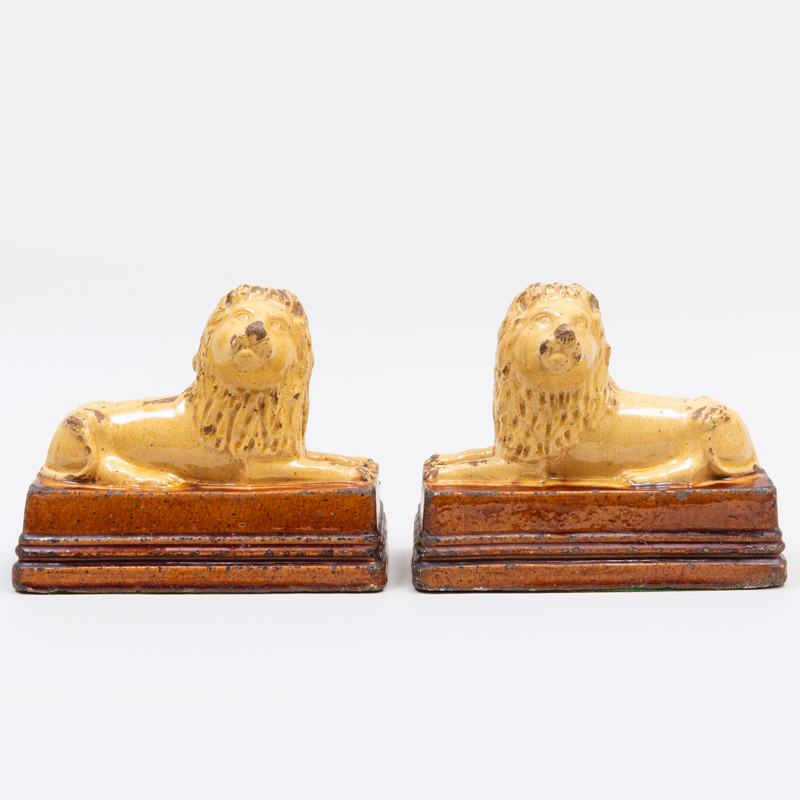 Appraisal: PAIR OF ENGLISH SALT GLAZED EARTHENWARE MODELS OF LIONS Unmarked