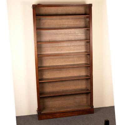 Appraisal: A Regency mahogany bookcase with reeded sides and roundels to