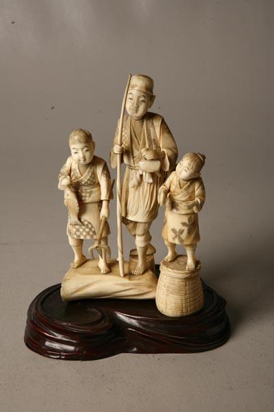 Appraisal: CARVED IVORY FIGURE GROUP Japanese Fisherman and children carrying fish