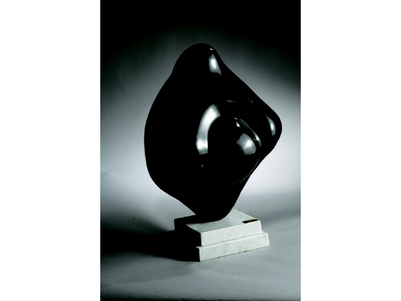 Appraisal: ERIK PITSOKOS Polished black Belgian marble sculpture on grey marble