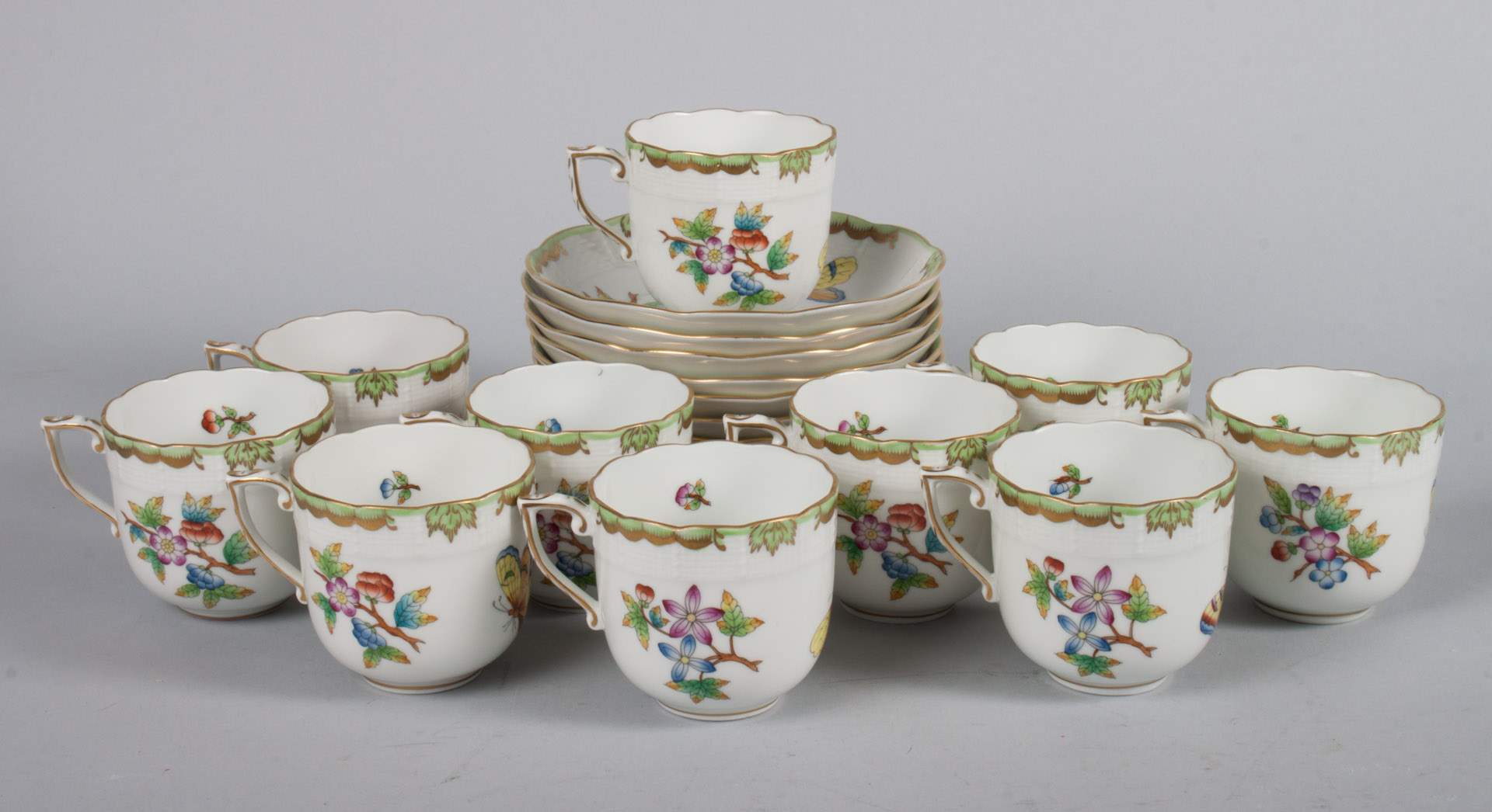 Appraisal: Herend porcelain cups and saucers in the Queen Victoria pattern