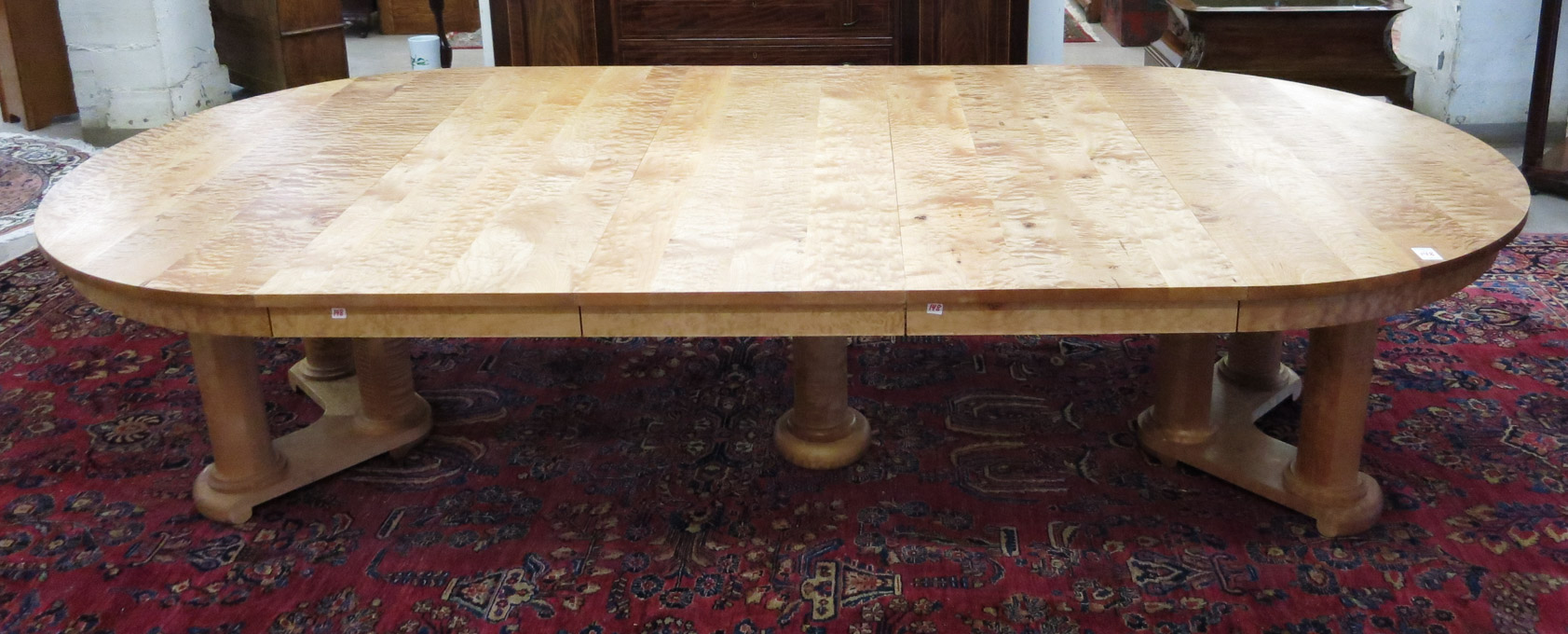 Appraisal: ROUND QUILTED MAPLE DINING TABLE WITH THREE LEAVES The Joinery