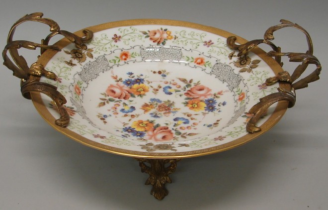 Appraisal: Compote features floral motif at center gilt banding at rim