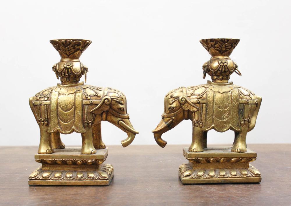 Appraisal: PAIR OF GILT BRONZE ELEPHANT CANDLESTICKS raised on rectangular base