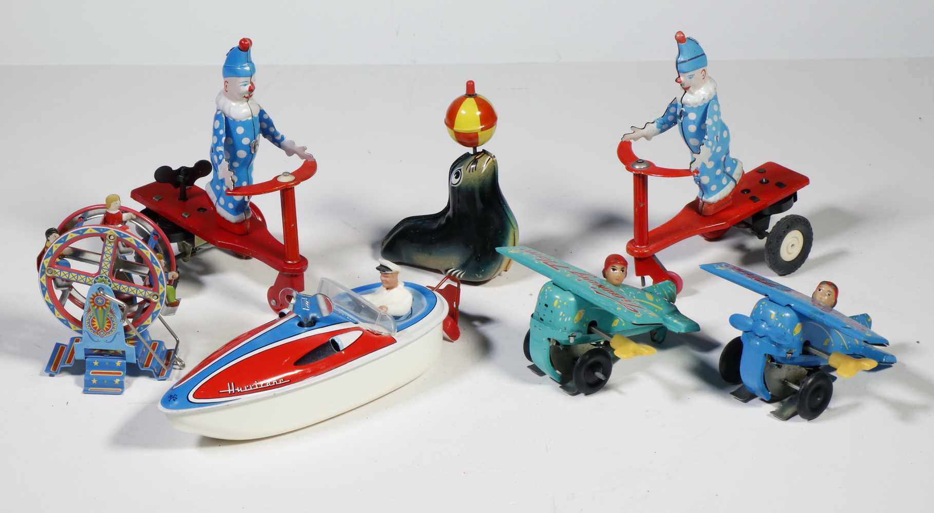 Appraisal: TIN LITHO TOYS Including Windup Clowns on trikes Windup Training