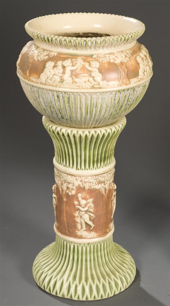 Appraisal: Roseville Donatello pedestal jardiniere c The green brown and white