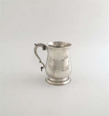 Appraisal: An early George III baluster pint mug with spread foot