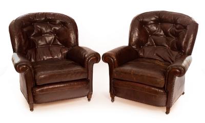 Appraisal: A pair of th Century leather club armchairs with buttoned