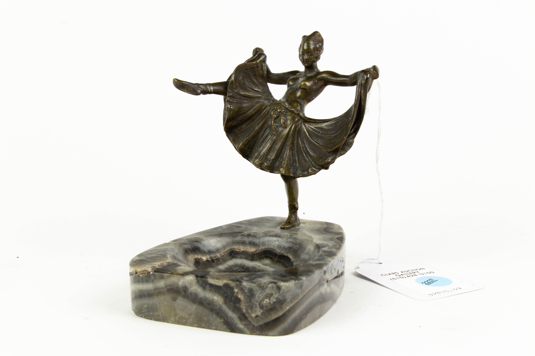 Appraisal: CONTINENTAL PATINATED BRONZE AND ONYX FIGURAL 'NAUGHTY' ASHTRAY Continental patinated