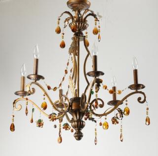 Appraisal: Patinated chandelier with amber glass prisms h Patinated metal chandelier