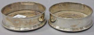 Appraisal: Pair of English silver wine coasters with wood bases dia