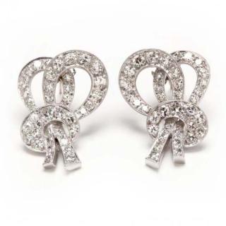 Appraisal: Platinum and Diamond Earrings in a stylized bow motif and