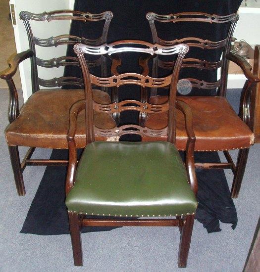 Appraisal: A pair of Chippendale style mahogany carver chairs the pierced