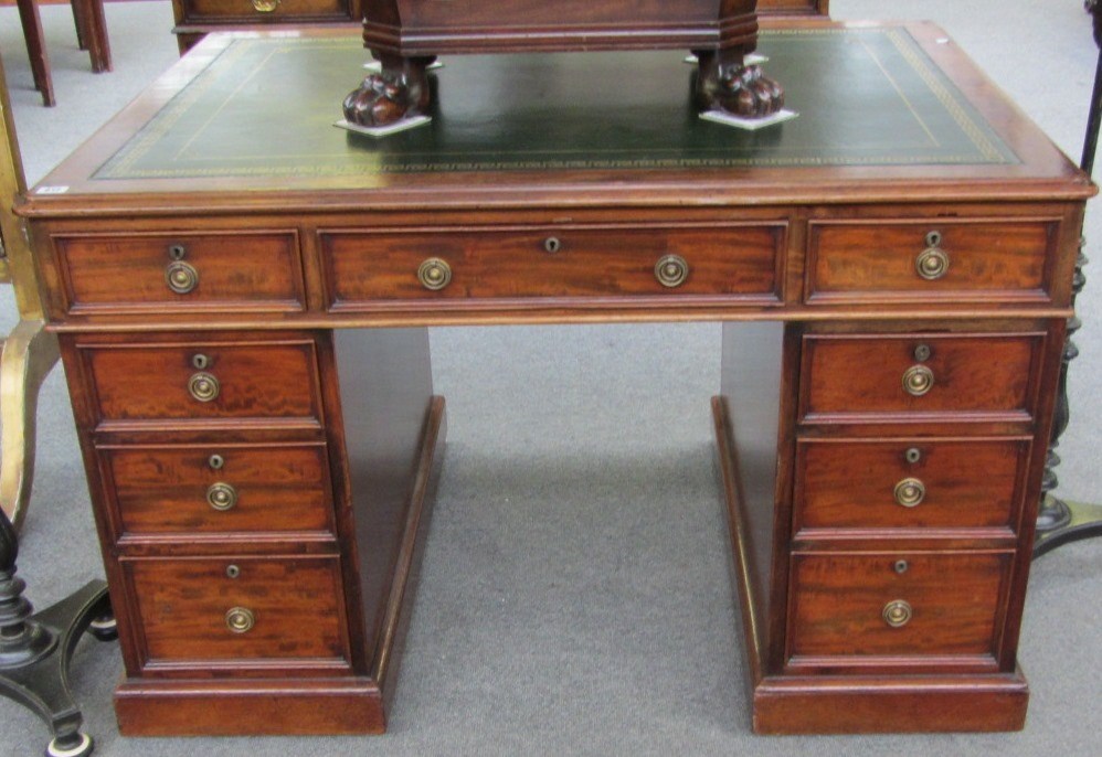 Appraisal: A Victorian mahogany partners desk the gilt tooled green leather