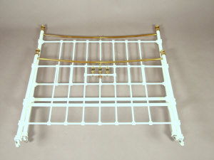 Appraisal: A Victorian white painted cast iron double bed with brass