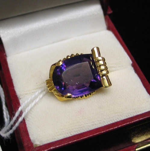 Appraisal: AMETHYST AND FOURTEEN KARAT GOLD SOLITAIRE RING with a fancy