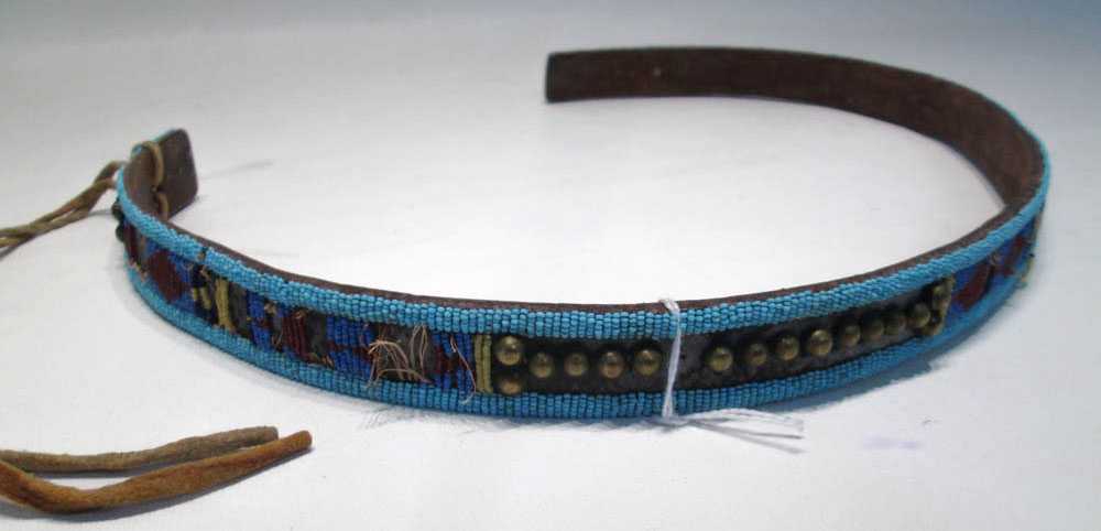 Appraisal: NATIVE AMERICAN CHILD'S BEADED LEATHER BELT with glass beads and