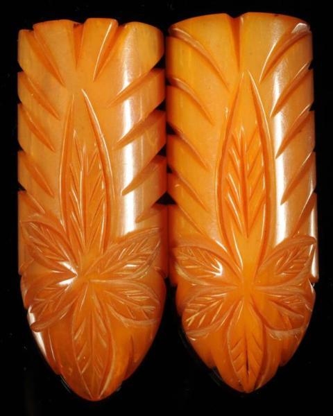 Appraisal: Pair of Large Bakelite Butterscotch Clips Condition Excellent Size -