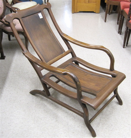 Appraisal: CHINESE HONGMU LOUNGE CHAIR having a paneled reclined back and