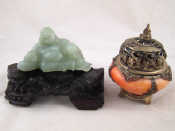 Appraisal: A carved green hardstone Buddha x cm high on a