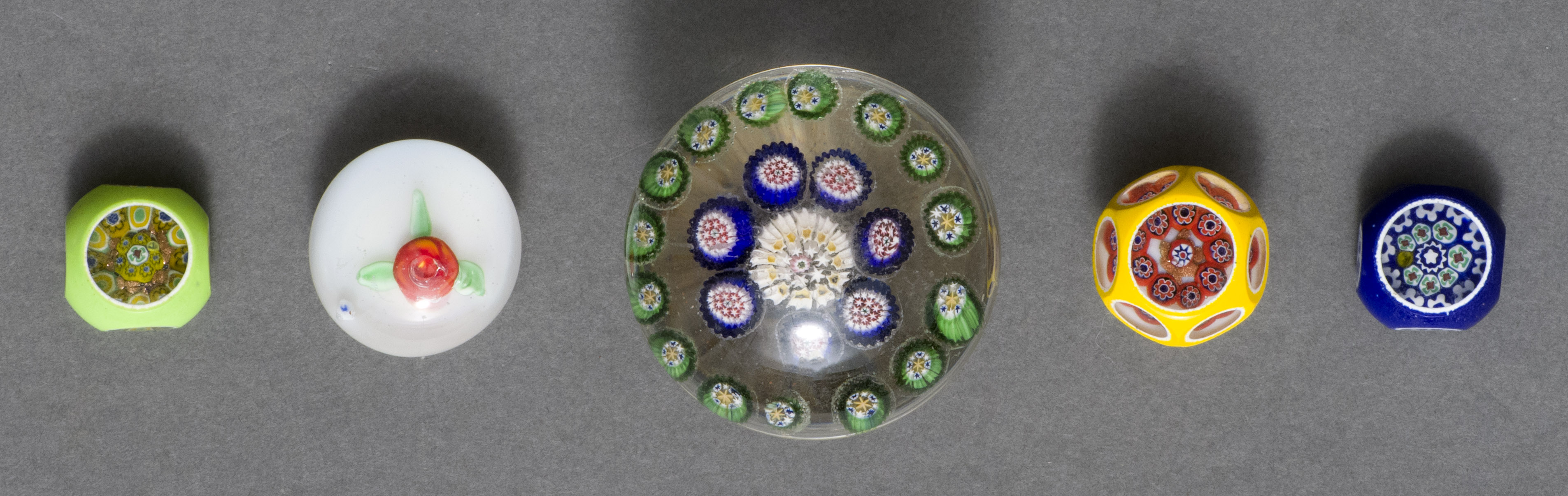 Appraisal: FIVE GLASS PAPERWEIGHT ODDMENTS th and th CenturyOne side of