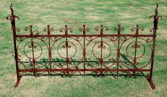 Appraisal: Ornamental wrought-iron fence segment shaped fleur-de-lis supported by finial-topped square