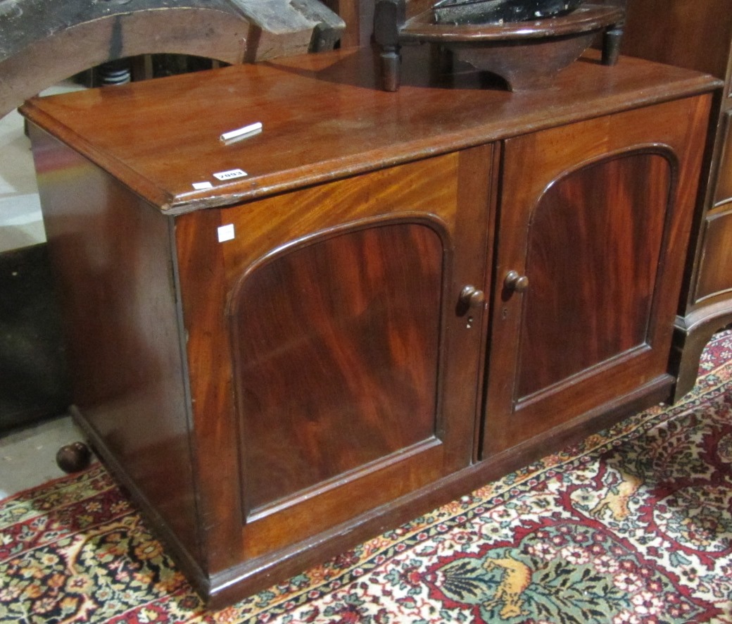 Appraisal: A th century mahogany low cupboard with a pair or