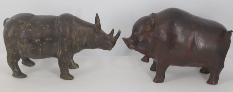 Appraisal: CHINESE BRONZE ANIMALS Includes a Chinese Han style rhinoceros and