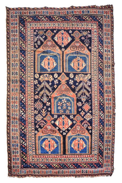 Appraisal: A LURI BLUE GROUND RUG with a central geometric rust